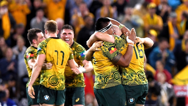 Australian players celebrating after the final whistle.