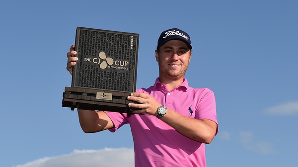 Justin Thomas holds the trophy after winning the CJ Cup