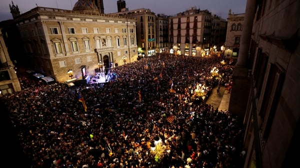 People celebrate after the declaration of independence at Catalan Assembly, at Sant Jaume square in Barcelona