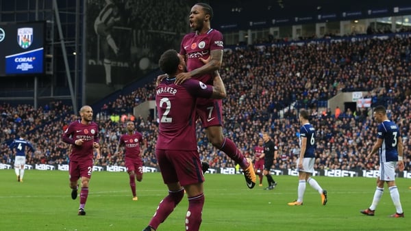 Raheem Sterling celebrates scoring the Manchester City's third goal