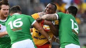 Enock Maki of Papua New Guinea takes on the Irish defence