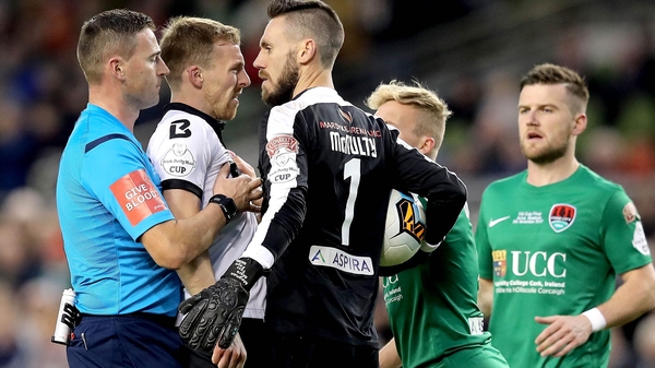 Dundalk's David McMillan clashes with Mark McNulty of Cork City