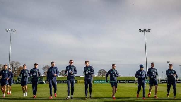 The Ireland team warm-up ahead of training