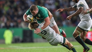 Tadhg Furlong carries hard against South African scrum-half Faf de Klerk last year