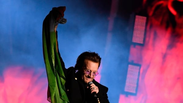 Bono tossed an Irish flag into the crowd