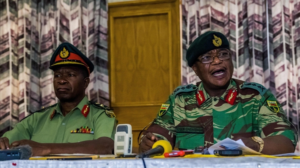 Army chief Constantino Chiwenga (R) has openly threatened to intervene in Zimbabwe's politics