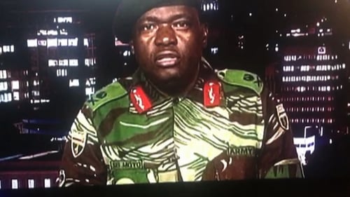 Major General Sibusiso Moyo, Chief of Logistics of the Zimbabwean army, addresses the nation on ZBC. Photo: Getty Images