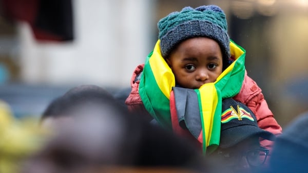 A child at a protest against Robert Mugabe's continued rule
