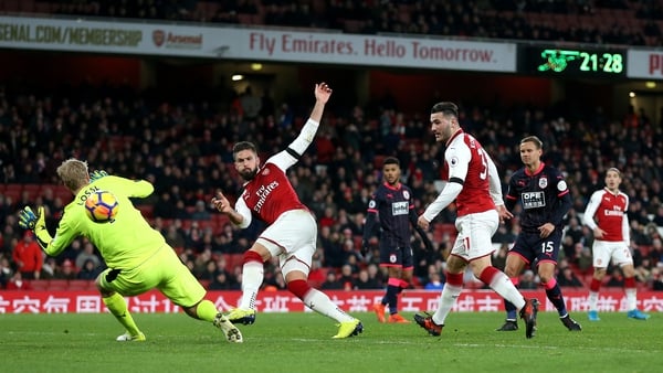 Olivier Giroud smashes home Arsenal's fourth in their demolition of Huddersfield