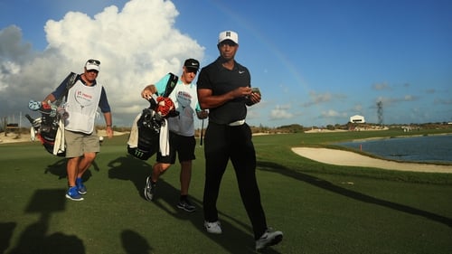 Tiger Woods was greeted on the 18th green by a Bahamas rainbow