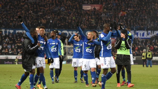 Strasbourg's players celebrate a famous victory