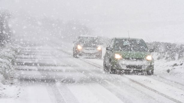 cars driving through snow