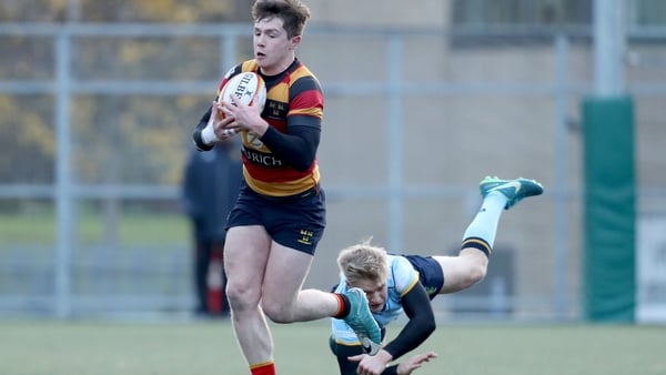 Lansdowne's Mark O'Keefe evades the challenge of Harry McNulty