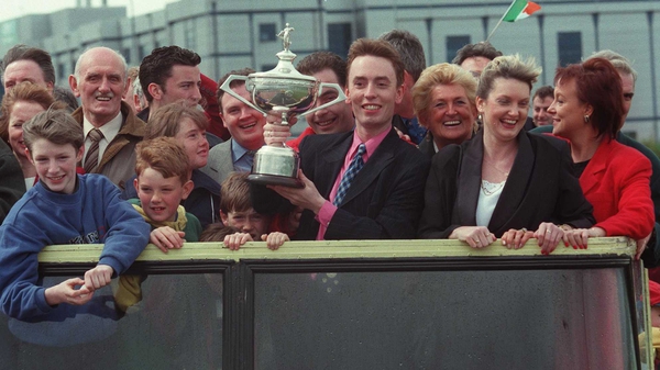 Ken Doherty parades the trophy back in 1997