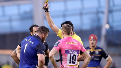 Referee Pascal Gauzère yellow-cards Cian Healy (L)