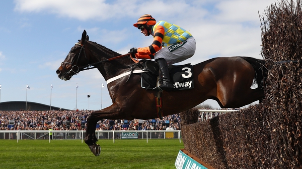 Might Bite under Nico de Boinville on the way to victory at Aintree