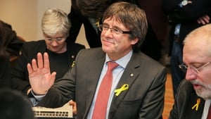 Former Catalan leader Carles Puigdemont reacts to the first preliminary results of the vote