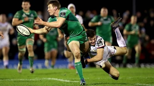Connacht's Eoin Griffin gets his pass away despite Jacob Stockdale's tackle