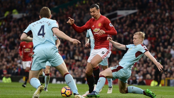 Mee (R) is prepared to tackle United once more as high-flying Burnley travel to Old Trafford