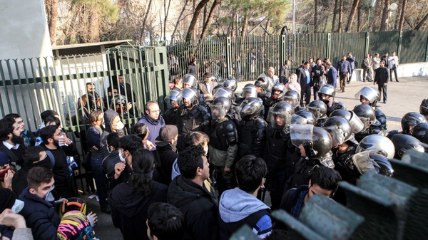 Iranian students scuffle with police at the University of Tehran during a demonstration