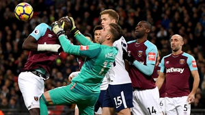 Adrian and Cheikhou Kouyate of West Ham United get in a tangle