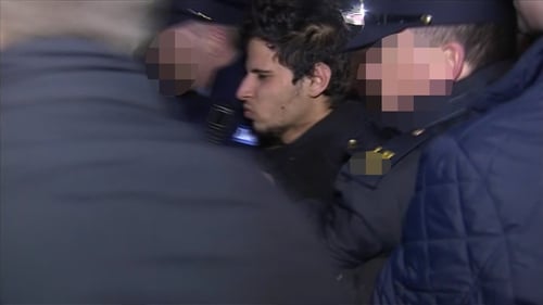 Mohammed Morei being escorted into the courthouse