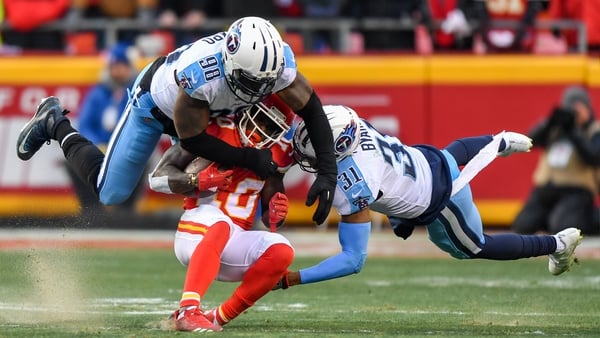 Kansas City Chiefs wide receiver Tyreek Hill (10) is tackled by outside linebacker Brian Orakpo (98) and free safety Kevin Byard (31) of the Tennessee Titans