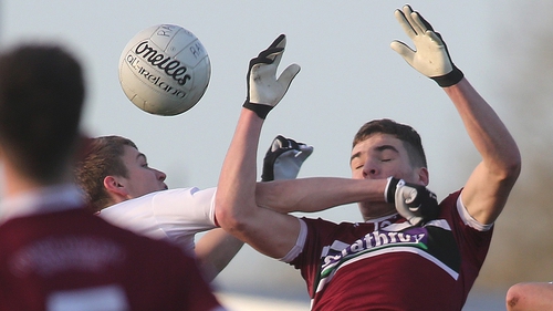 St Mary's Jarlath Og Burns and Ben McDonnell of Tyrone compete in the air
