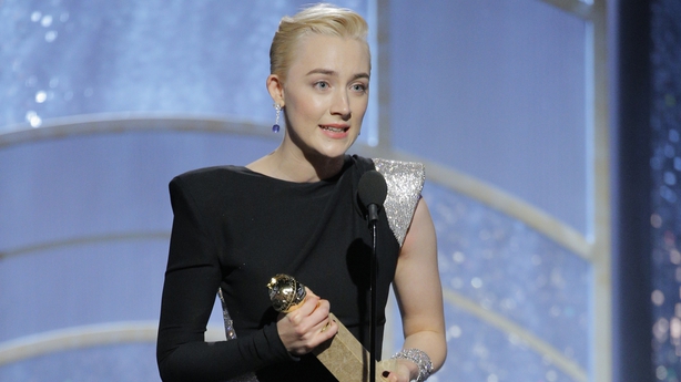 Saoirse Ronan accepting her Golden Globe on stage at Beverley Hilton Hotel