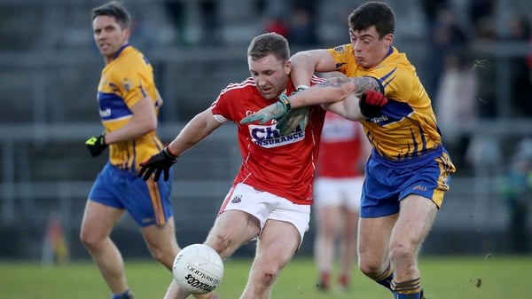 Cork's Michael Hurley strikes under pressure from Kieran Malone of Clare