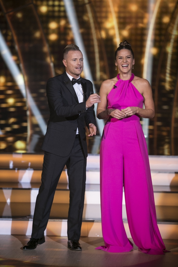 Amanda's jumpsuit is from Umut Kutluk