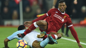 Raheem Sterling fouls Liverpool midfielder Georginio Wijnaldum duringa thrilling Premier League clash at Anfield