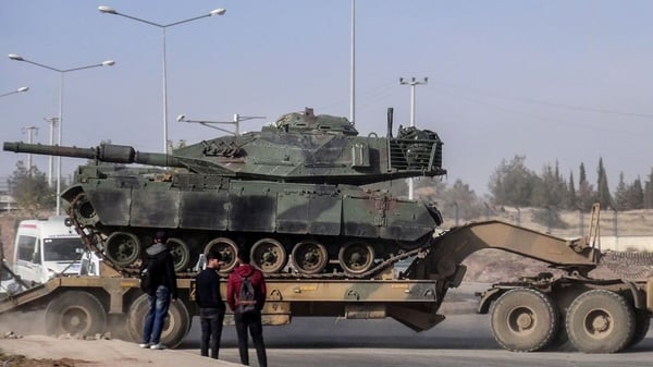 The military build-up on Turkey's southern border includes tanks, special forces, army units and Turkish-backed Syrian rebels
