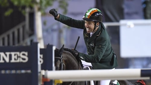 Cian O'Connor celebrates after riding his horse Good Luck to a clear round, sealing victory for the Irish team in Gothenburg