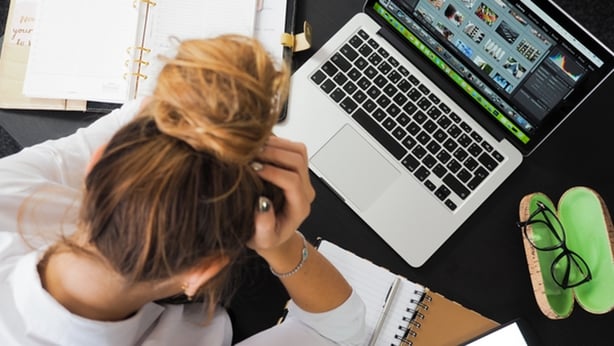 Stressed woman at desk