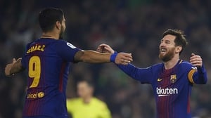 Lionel Messi and Luis Suarez celebrate