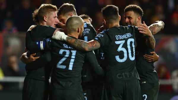 Manchester City players celebrate their second goal against Bristol City