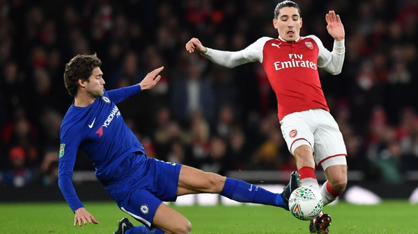 Chelsea's Marcos Alonso (L) tackles Hector Bellerin
