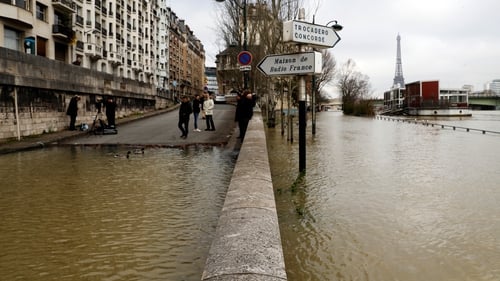 Floodwaters overflow the banks of the Seine river near the Liberty Statue in Paris
