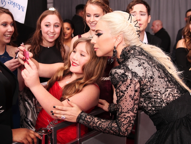 Gaga strikes a pose with a young fan