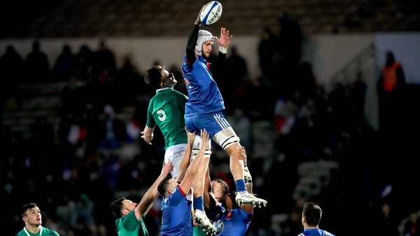 Thomas Lavault wins a line-out despite the close attentions of Ireland's Jack Dunne