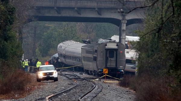 An Amtrak passenger train apparently travelling on the wrong track crashed into a parked CSX Corp freight train
