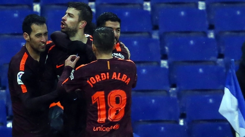 Gerard Pique is mobbed after his goal