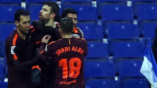 Gerard Pique is mobbed after his goal