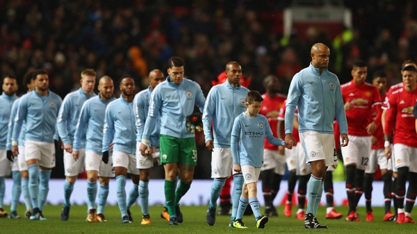 Manchester City and Manchester United enter the field for their clash at Old Trafford last December
