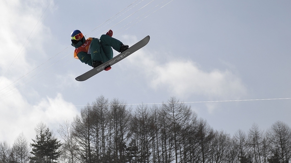 A snowboarding competitor in action at the Winter Games