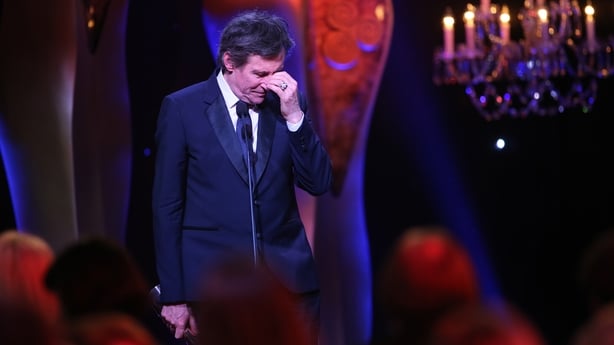 Gabriel Byrne emotional as he accepts Lifetime Achievement Award at the IFTAs