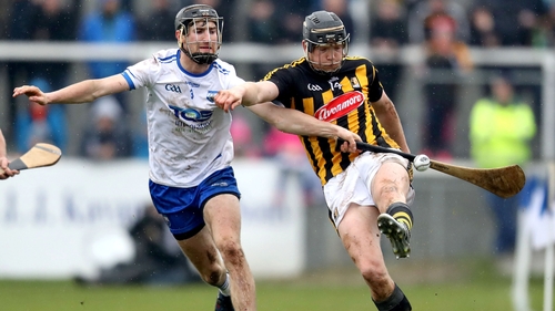Kilkenny forward Walter Walsh kicks the sliother under pressure from Waterford full-back Barry Coughlan