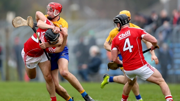 Cork's Christopher Joyce and Peter Duggan of Clare in a battle for possession at Cusack Park