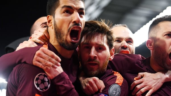 Luis Suarez swamps Leo Messi after his crucial leveller at Chelsea